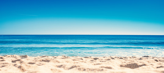 Blue ocean wave on sandy beach. Summer Vacation concept . - obrazy, fototapety, plakaty