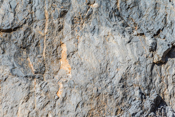 background and texture of mountain layers and cracks in sedimentary rock on cliff face. Cliff of rock mountain.