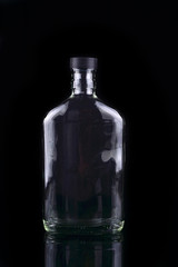 Empty bottle isolated in black