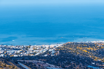 Top view from the autumn mountains to the village of Malia, roads and the nearby villages of the field and the Aegean Sea. Crete, Greece