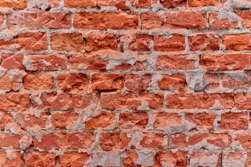 Simple photo background pattern of red broken bricks wall.