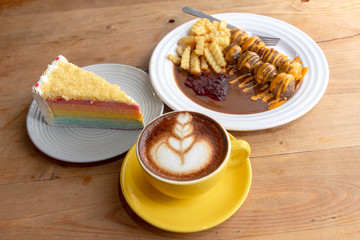 meatballs with brown sauce ,coffee and mille crepe rainbow cake