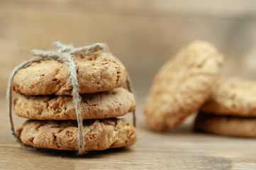 stack of cookies tied with a rope on a wooden background