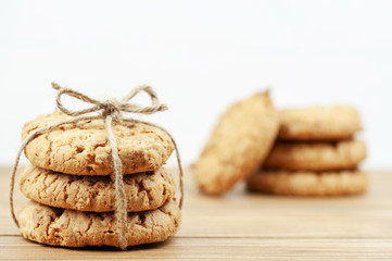 stack of cookies tied with a rope on a wooden background