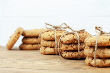 stack of cookies tied with a rope on a wooden background