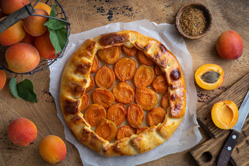 apricot galette on wooden background