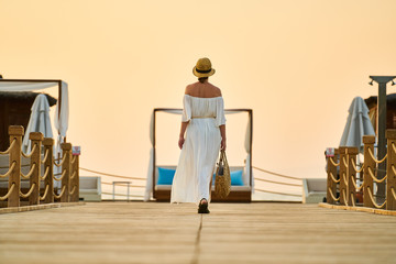 Romantic sunset and alone woman