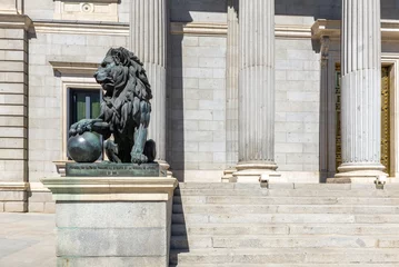 Foto op Plexiglas Lion statue at the entrance of the Spanish Parliament (Congreso de los Diputados), Madrid, Spain © Noradoa