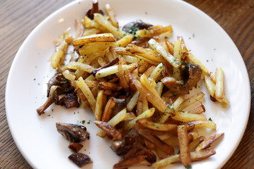 Fried potatoes with mushrooms