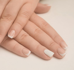 hands of woman with manicured nails white