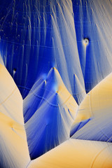 Colorful micro crystals in polarized light. Photo through a microscope.