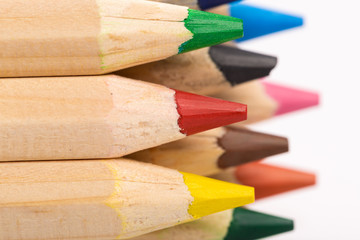 Wooden colorful ordinary pencils isolated on a white background