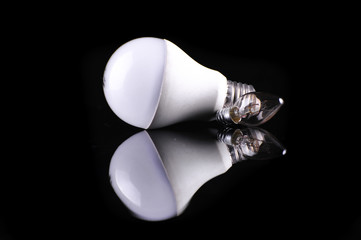 Light bulb with frosted glass isolated on black