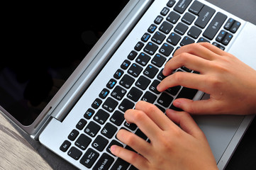 Close-up of typing female hands on keyboard