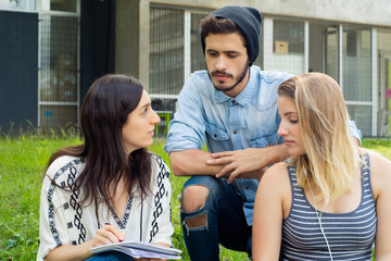 Group of  Group  of students relaxing in School Campus.