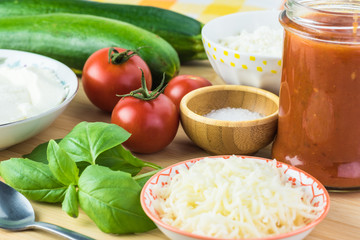 Zucchini rollups with cheese in marinara sauce.