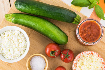 Zucchini rollups with cheese in marinara sauce.