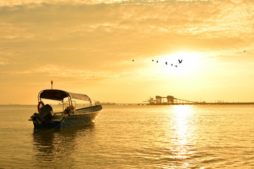 Fisherman boat with sunset background