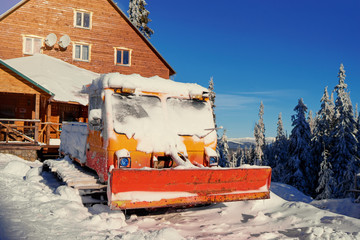 Huge snow machine truck outdoor.