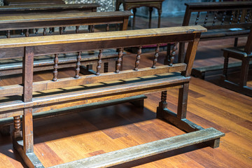 benches to pray inside a church. concept of faith and religion