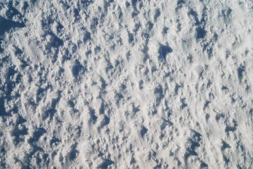Textured white frosted snow background.
