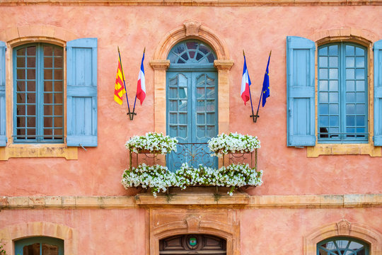 Colorful ochre colored fa?ade of Mairie (mayor's office) in Roussillon, Vaucluse, Provence-Alpes-C?te d'Azur, France