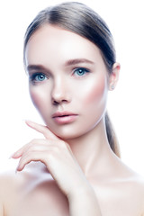 Fototapeta premium Beaty studio portrait of attractive young woman with healthy perfect skin, nude natural make-up, hand near face. Skincare facial treatment spa concept. Isolated. White background