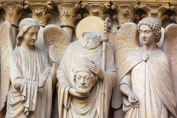 France, Paris, Notre Dame Cathedral, detail of statues on facade