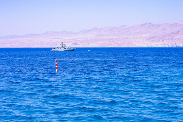 small military patrol ship protected board between Jordan and Israel in Gulf of Aqaba Red sea bay Middle East region 