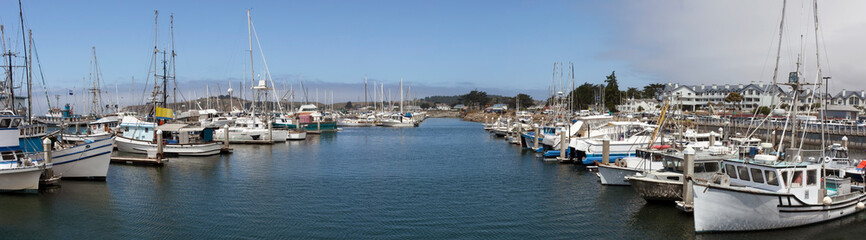 Fototapeta na wymiar Moored fishing boats at Pillar Point, Half Moon Bay, California. Panorama.