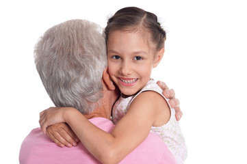 Portrait of happy elderly man with cute granddaughter