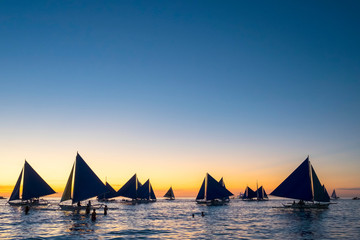 Sailboats at sunset on White Beach, Boracay Island, Aklan Province, Western Visayas, Philippines