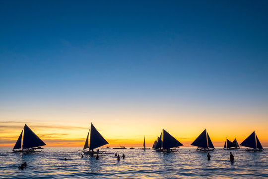 Sailboats at sunset on White Beach, Boracay Island, Aklan Province, Western Visayas, Philippines