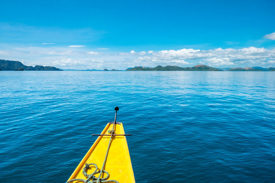 Bow of an outrigger boat on blue water in Hidden Lagoon, Coron Island, Palawan, Philippines
