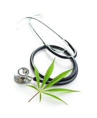 Marijuana cannabis leaves and stethoscope.