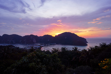 Wonderful sunset on Phi Phi Don island view point. Beautiful landscape with tropical sea lagoon.