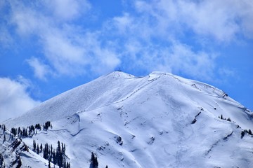 Aspen Highlands Bowl during spring still gets its clients.