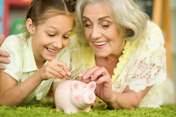 portrait of happy beautiful grandmother with granddaughter