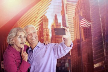 Portrait of happy senior couple taking selfie