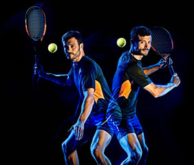 one caucasian Tennis player man studio shot isolated on black background with light painting blur effect