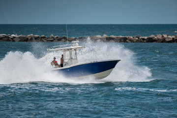Couple on a fishing boat in Miami Beach enjoying summer vacation