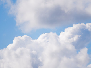 Naklejka na ściany i meble Blue sky with beautiful cumulus clouds. Sunny weather before the rain.