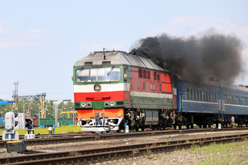 Fototapeta na wymiar passenger locomotive picks up speed