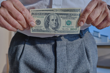 A man with us dollar bills in his hand. Concept of business and finance