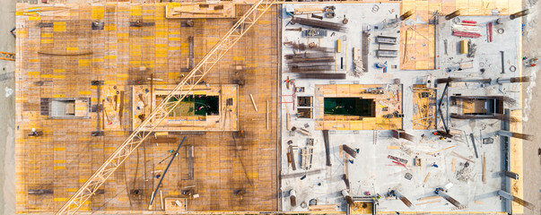 Building under construction - construction site workers - aerial - Top View
