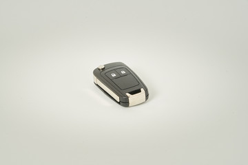 Car key on a white background. Perfect symbol to acquire a vehicle, to have property etc.