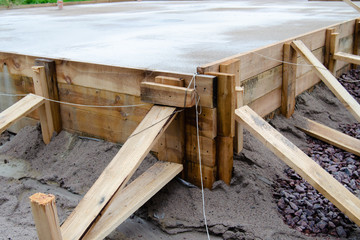 poured cement foundation for the construction of the cottage, wooden formwork