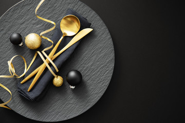 Gold cutlery served on plate for Christmas Dinner