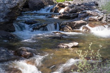 Naklejka premium River over rocks