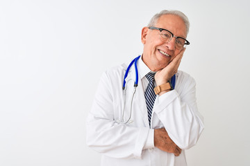 Senior grey-haired doctor man wearing stethoscope standing over isolated white background thinking looking tired and bored with depression problems with crossed arms.